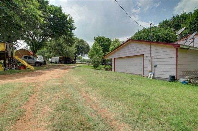 Tract 2: Single Family 6 Bedroom Brick Home with Garage Apartment and other improvements on 1 acre.