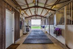 Tract 1: 19.3 Acres with 2512' Home, 13 Stall Barn, Covered & Outdoor Arenas, Horse Walker & Pasture