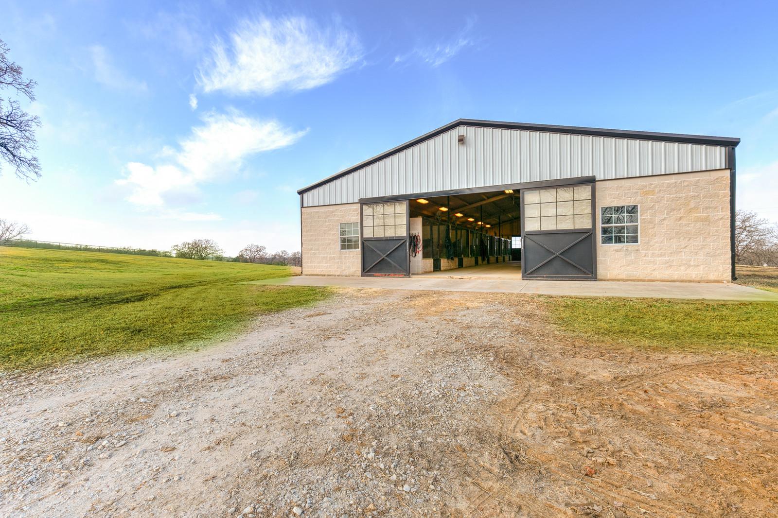 Tract 1: Executive Home w/heated pool, 11 stall show barn & pond on 15 acres