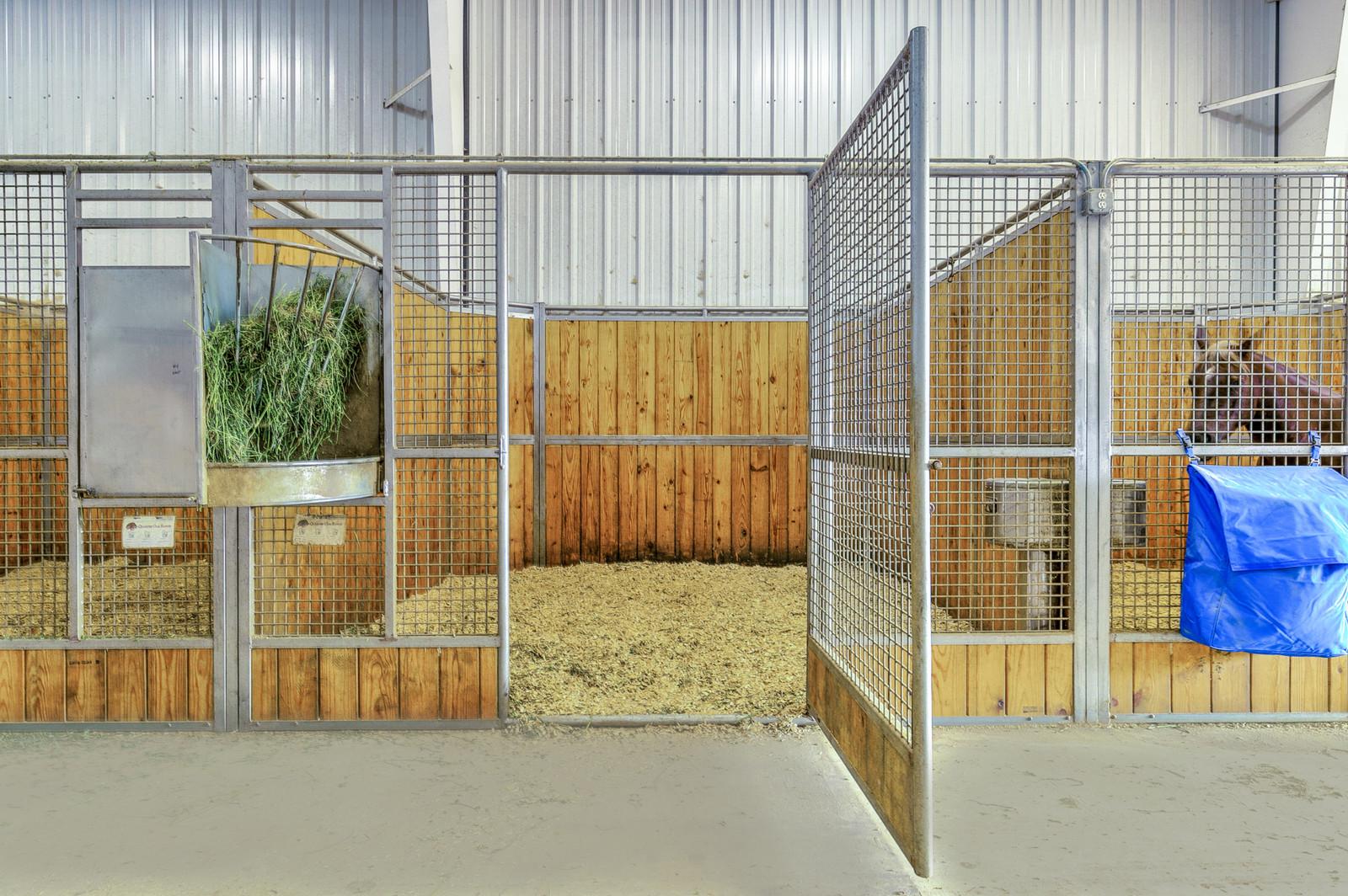 Tract2: 125' x 250' Indoor Arena, 44 stalls, 4 apartments ALL UNDER ONE ROOF on 13.4 acres