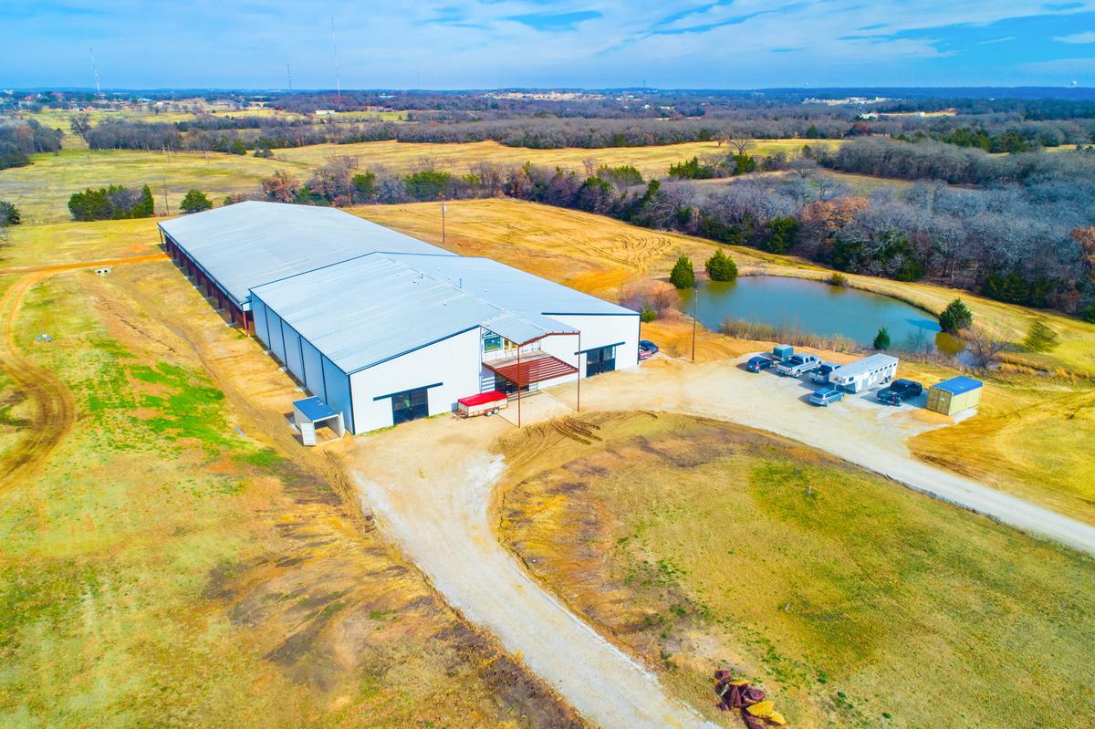 Tract2: 125' x 250' Indoor Arena, 44 stalls, 4 apartments ALL UNDER ONE ROOF on 13.4 acres