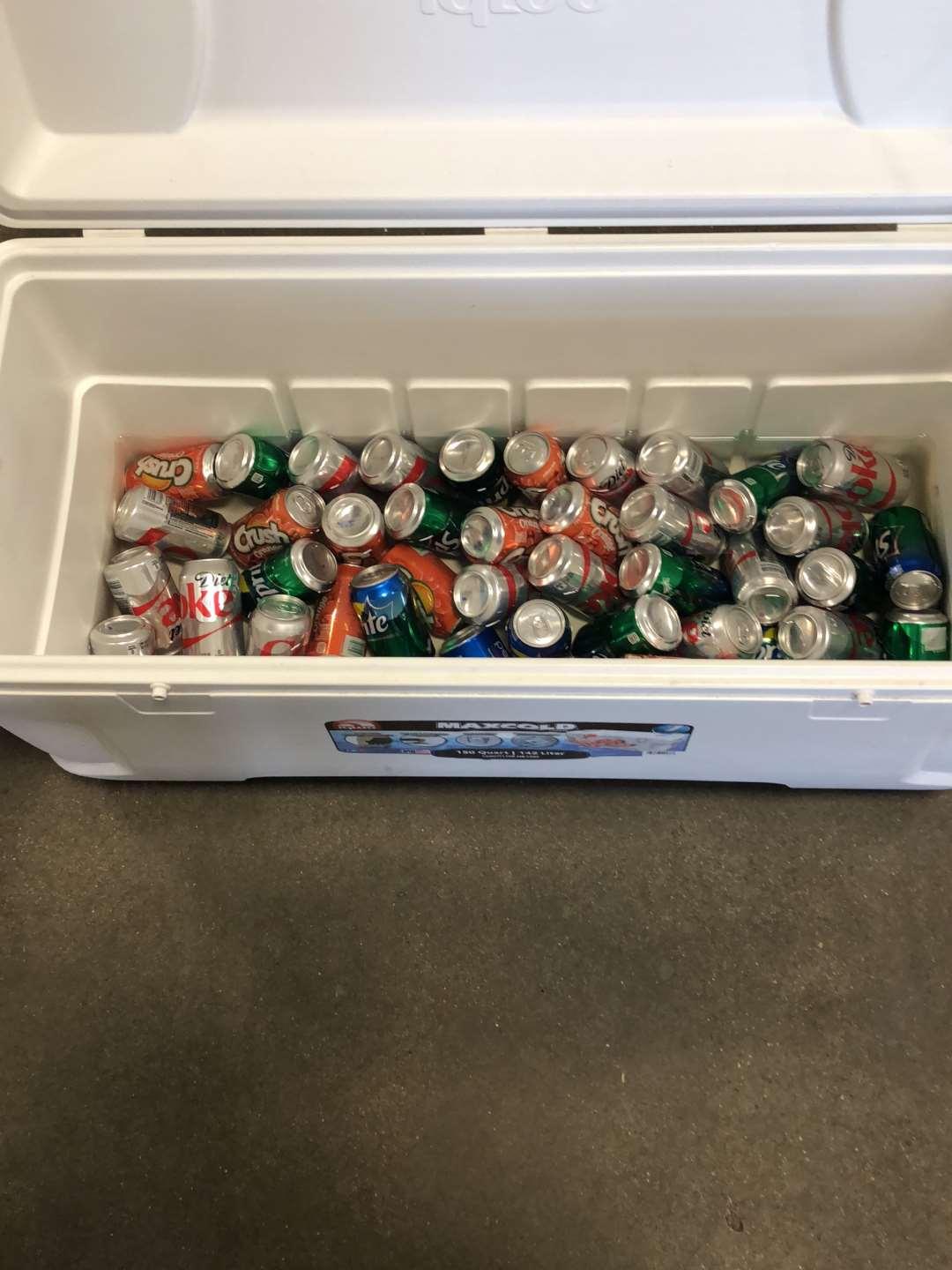(1) Igloo 150 Quart Cooler Filled With Misc. Cans Of Pop