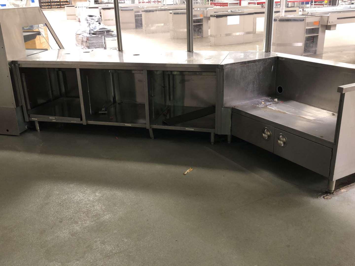 L shaped 12 ft long stainless steel service counter with interior storage