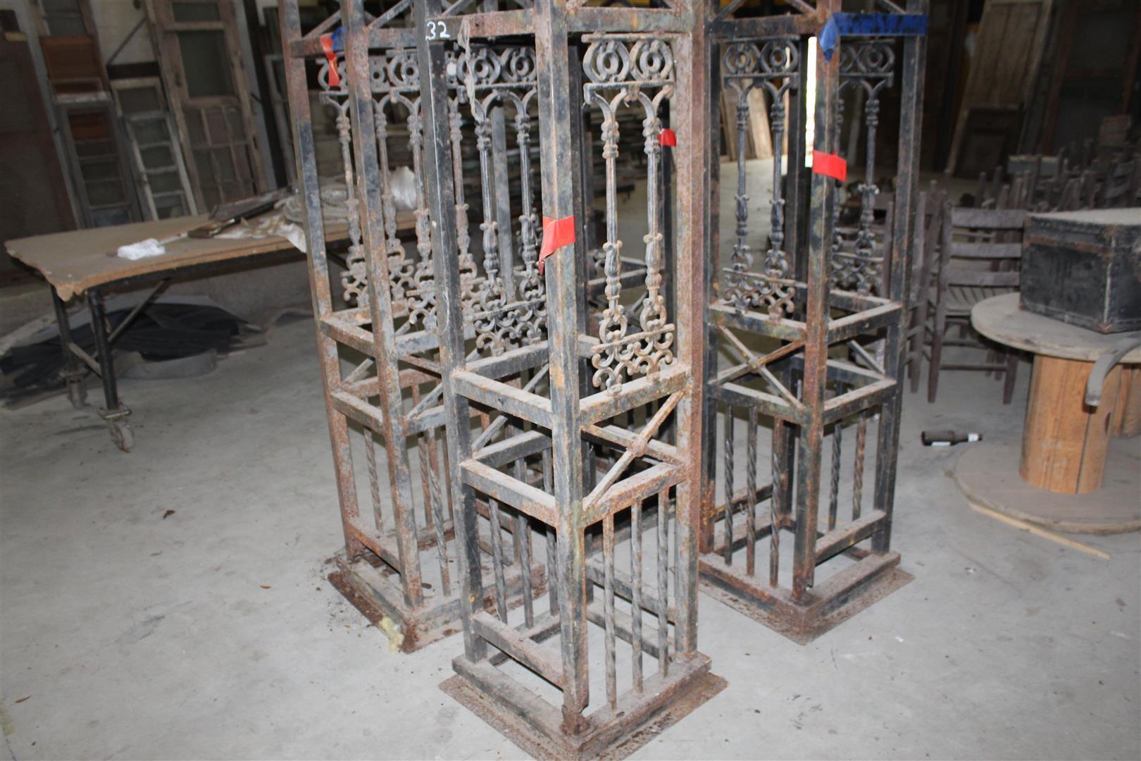 Lot of 4 salvaged antique iron columns approximately 16" x 16" x 91" tall