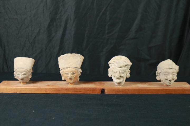 4 Stone Heads on Board