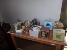 Group of Approx. (10) Small Clocks on Top of Book Shelf