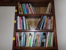 Large Group Of Books, Top 3 Shelves of Built-In Bookshelf, In Living Room,