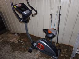 Nordic Track Exercise Bike and Some Ski Poles (Lean to Side of Garage)