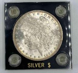 1890 Morgan Silver Dollar in Capital holder. AU