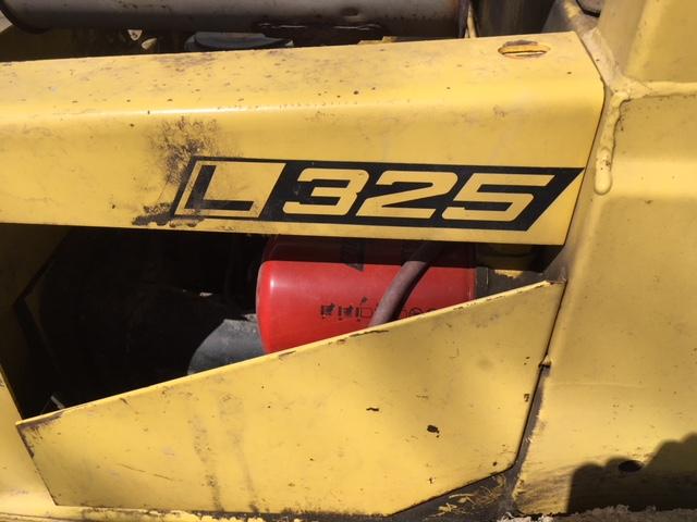 1978 New Holland L325 g. skidloader S.#466914 w/material & tine buckets, 2,862 hrs.