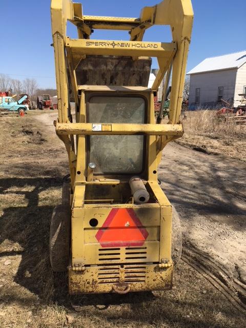 1978 New Holland L325 g. skidloader S.#466914 w/material & tine buckets, 2,862 hrs.