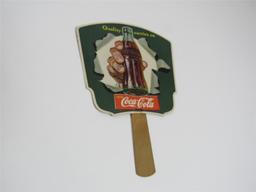 1940s Coca-Cola die-cut cardboard fan with wooden handle.