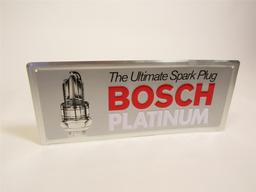 NOS Bosch Platinum Spark Plug single-sided embossed tin automotive garage sign with plug graphic.