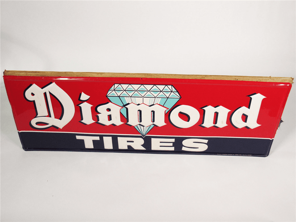 CIRCA 1940S DIAMOND TIRES EMBOSSED TIN SIGN