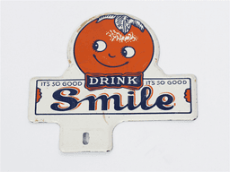 1930S SMILE ORANGE SODA TIN LICENSE PLATE ATTACHMENT SIGN