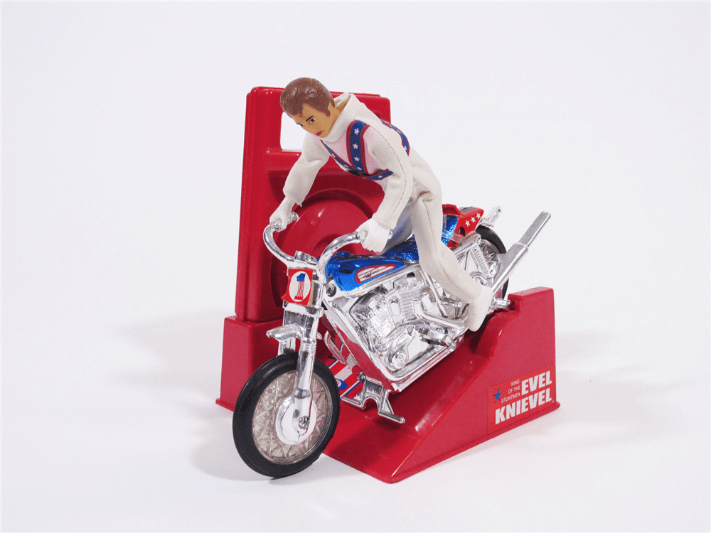 1970S EVEL KNIEVEL DAREDEVIL MOTORCYCLE WITH WIND-UP LAUNCHER