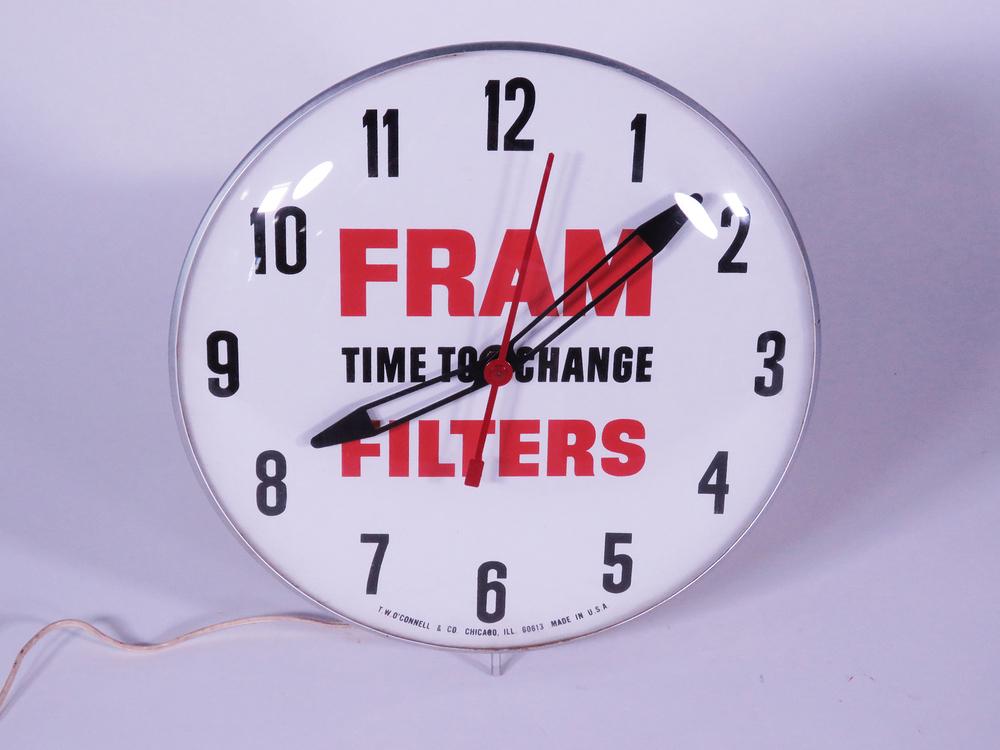 1960S FRAM FILTERS GLASS-FACED ELECTRIC CLOCK