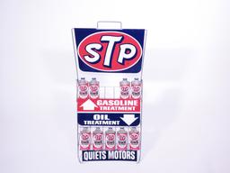 CIRCA 1960S STP ENGINE TREATMENT DISPLAY RACK FULL OF STP CANS