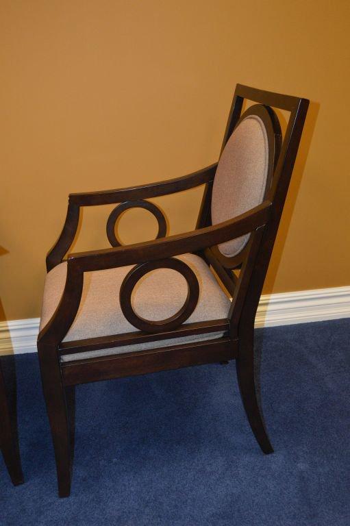 PAIR OF DARK BROWN WOOD ARM CHAIRS WITH TAN