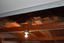 LARGE QUANTITY OF LUMBER AND PIPE IN RAFTERS