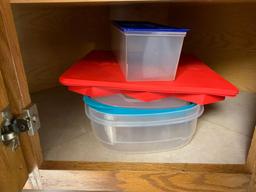 Cabinet full with reusable storage containers plates deviled egg container plus