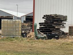 Tires pallets 50 gallon drums tank holders all items on the side of the building