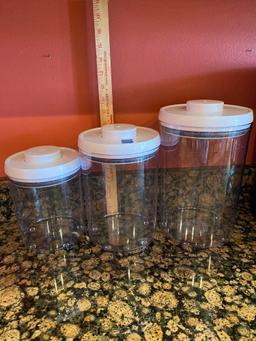 Three Plastic Sealable Canisters