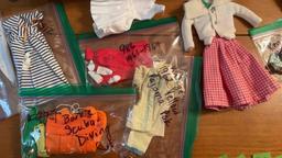 vintage Barbie outfits in chest- many researched and labeled