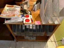 bookshelf, with metal file organizers, and a whole bunch of books to help you start your music