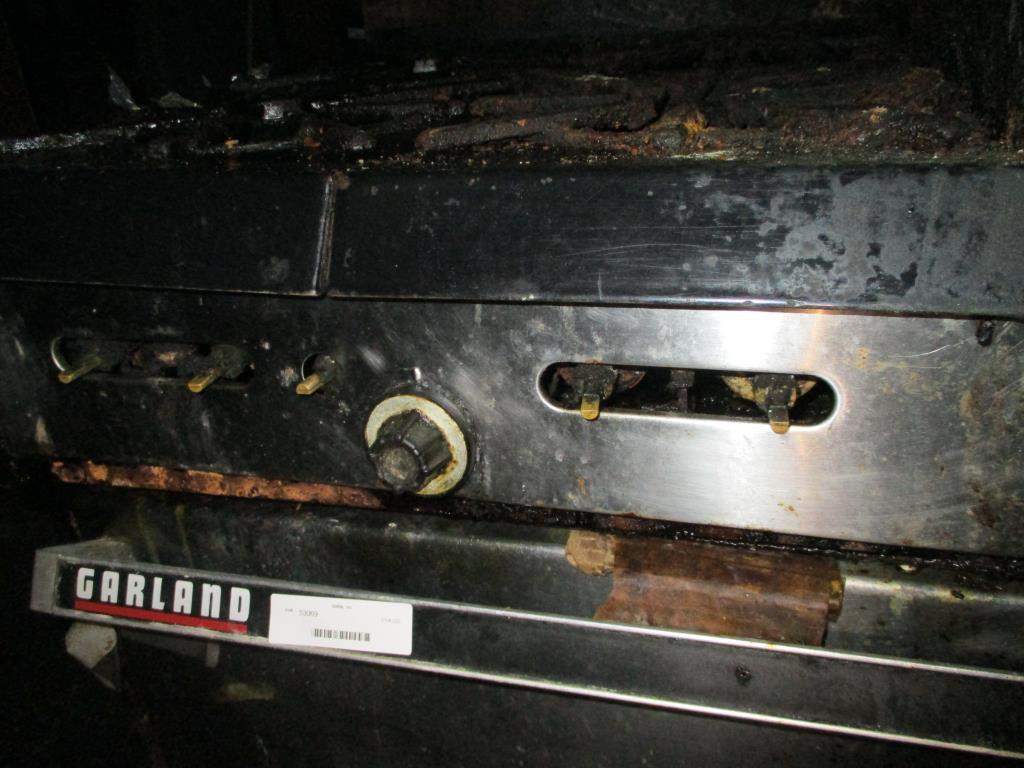 Garland 4 Burner Oven & Griddle Top.