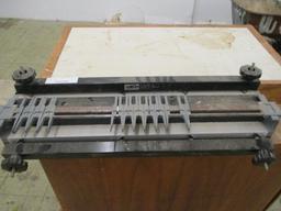 Leigh Industries Dovetail Jig on Wooden Cabinet.