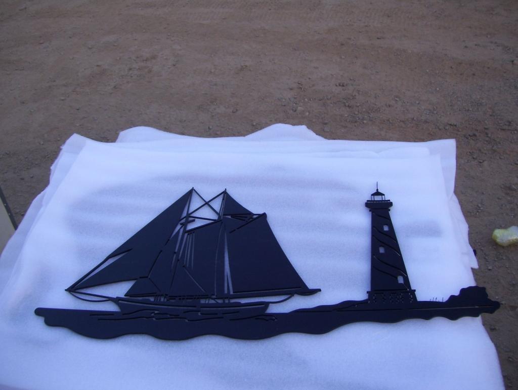 Unused 32" Metal Sailboat Wall Hanging.