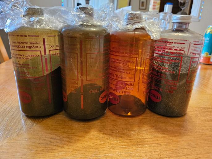 Lot of (4) MEC Shell Reloading Bottles (Partially filled with BBs, See Pics)