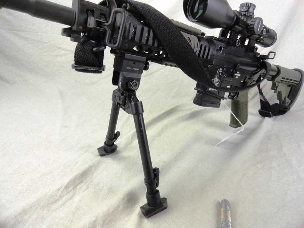 83. Bushmaster XM-15-E25, Auto 223-Cal., SN:L092461, Tricked Scope