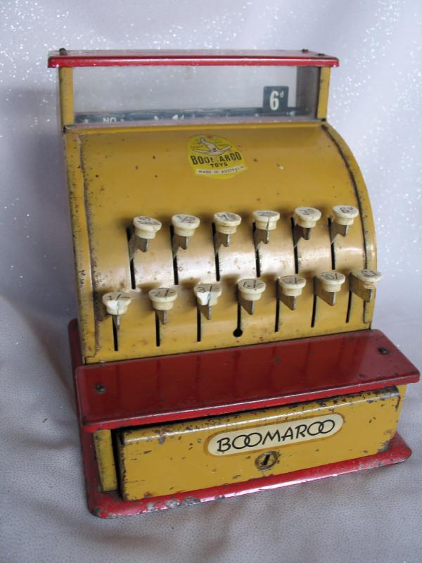 Three toys:- Boomaroo cash register with some child wear and rust showing.
