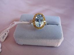 Ladies dress ring 14K yellow Gold, stamped 14K. Oval large 7.8ct sky blue T