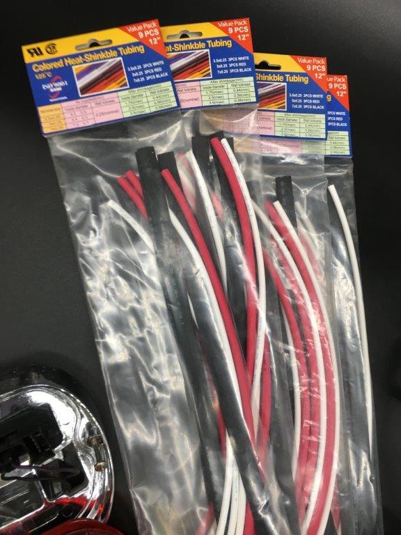 ASSORTED MOTORCYCLE PARTS AND SHRINK TUBES