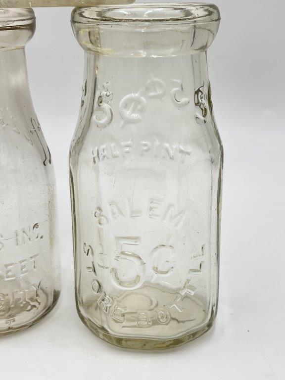 FIVE ANTIQUE GLASS MILK JARS