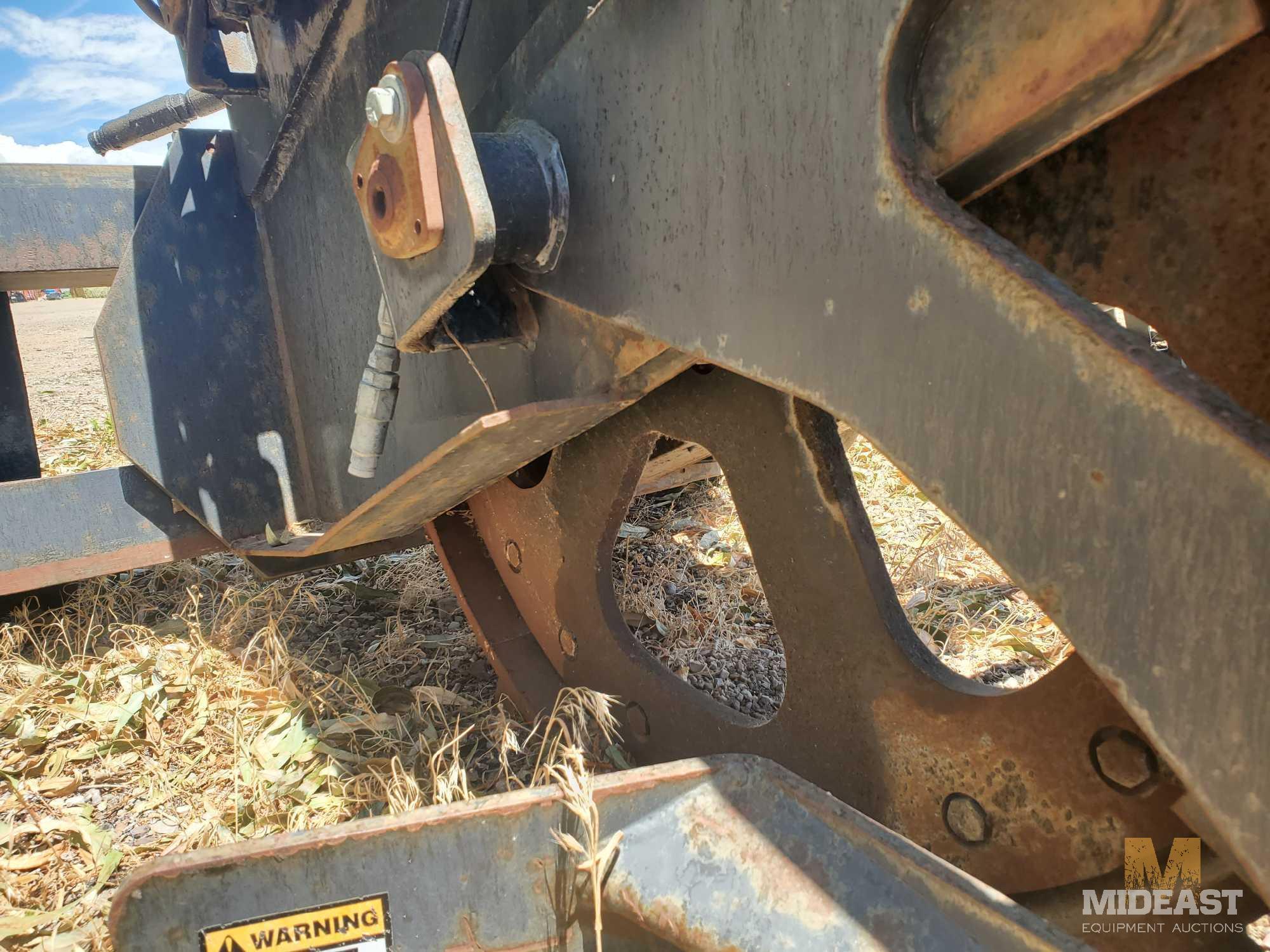 Bradco Rock Saw skid steer attachment.