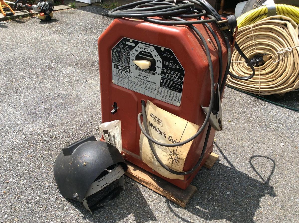 Lincoln A-C 225-S stick welder with helmet and rods