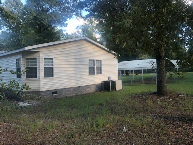 5.67 ACRES W/ 2560 SQ FT MANUFACTURED HOME, 12X16 SUNROOM,