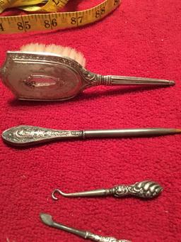 5 antique Sterling handled items including brush.