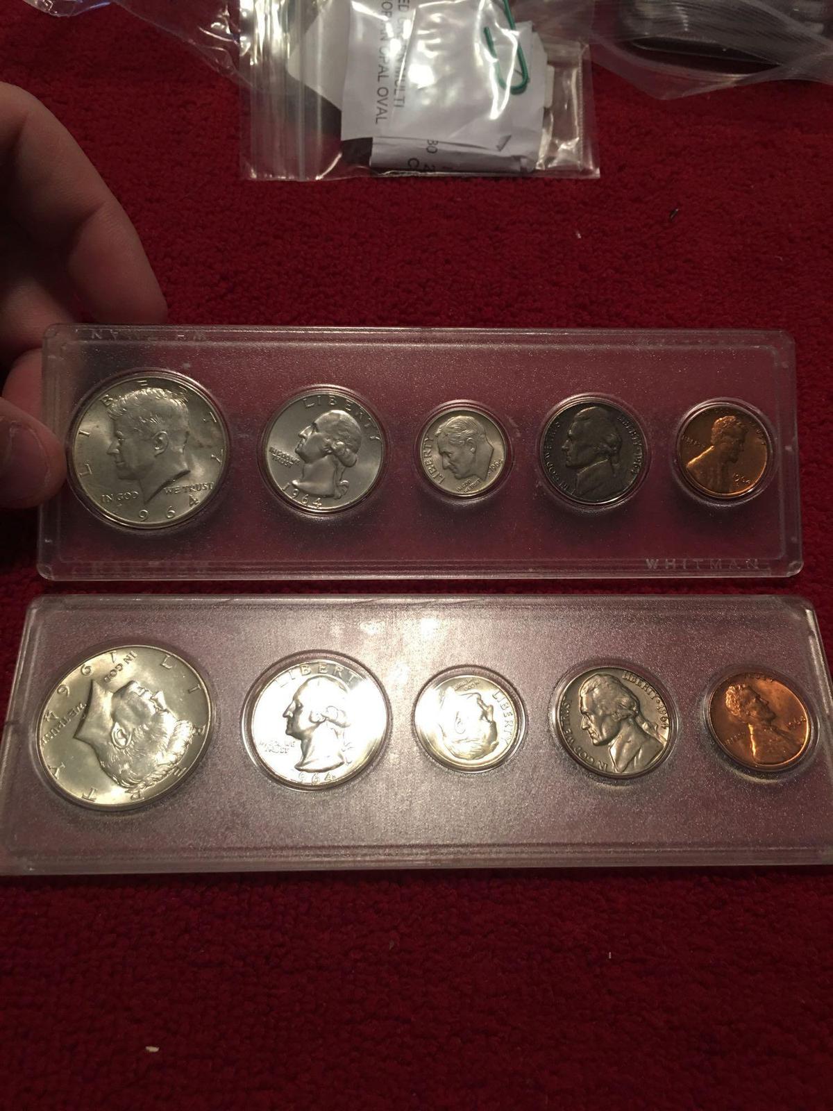 Two 1964 uncirculated US coin sets. In cases