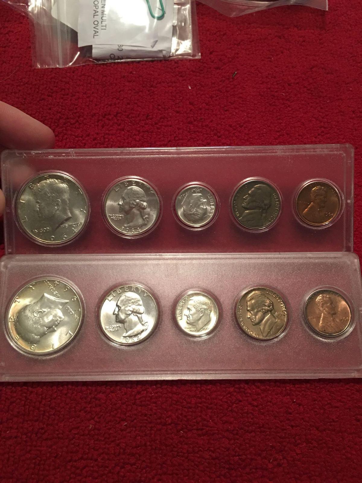 Two 1964 uncirculated US coin sets. In cases