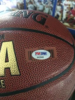 Magic Johnson signed Spaulding basketball with PSA authentication in display case