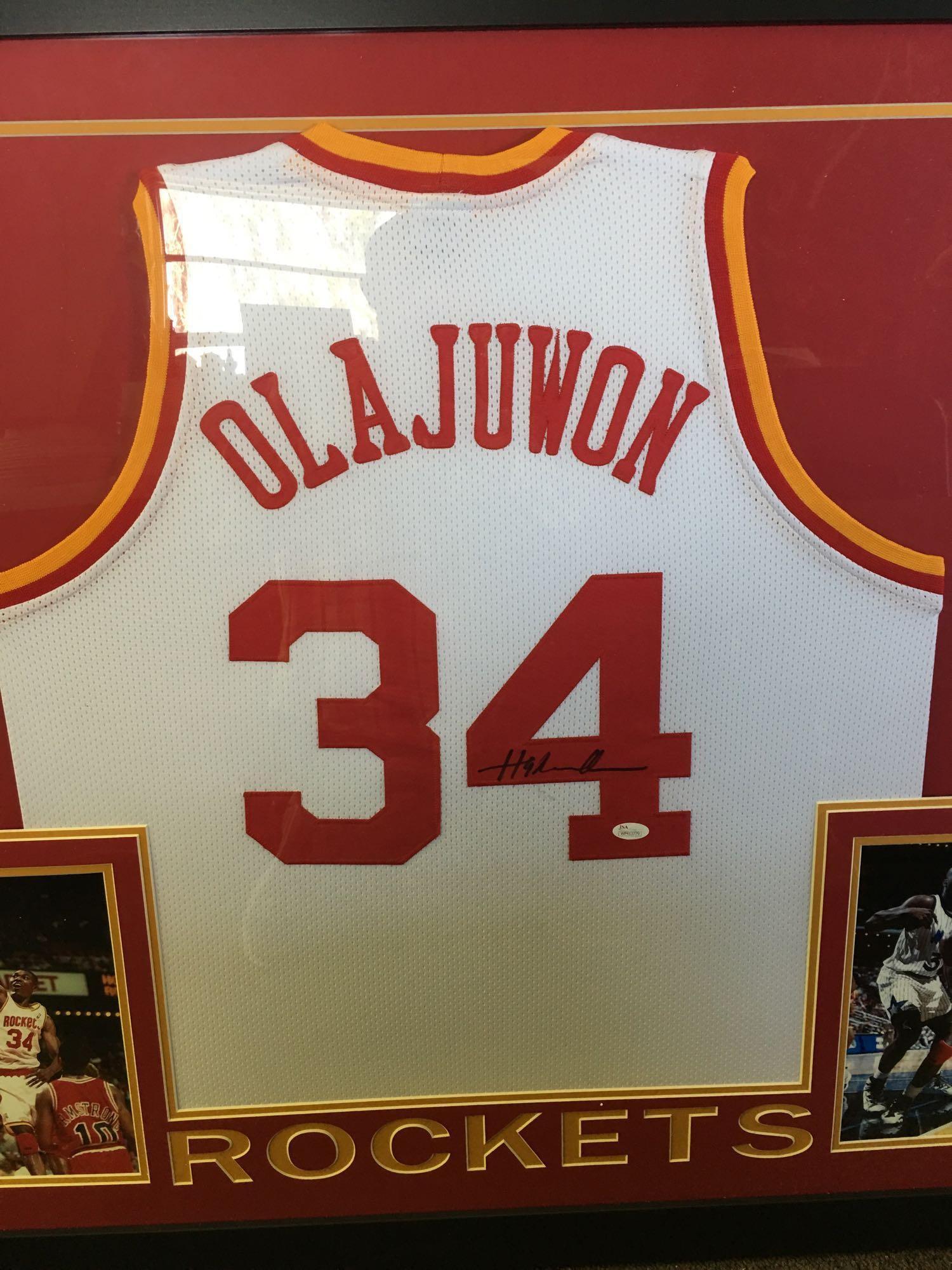 Wonderful authentic Signed Hakeem Olajuwon jersey framed and matted With photos