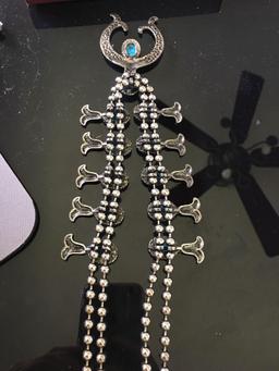 Squash style silver toned necklace.