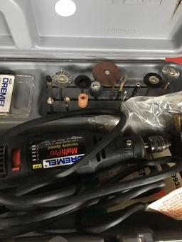 Dremel tool in hard case with attachments