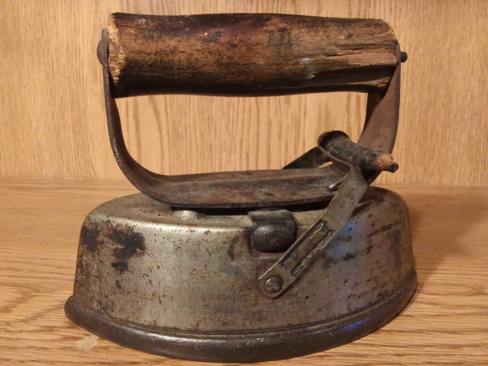 VERY OLD ASBESTOS LOCKING SAD IRON WITH WOODEN HANDLES