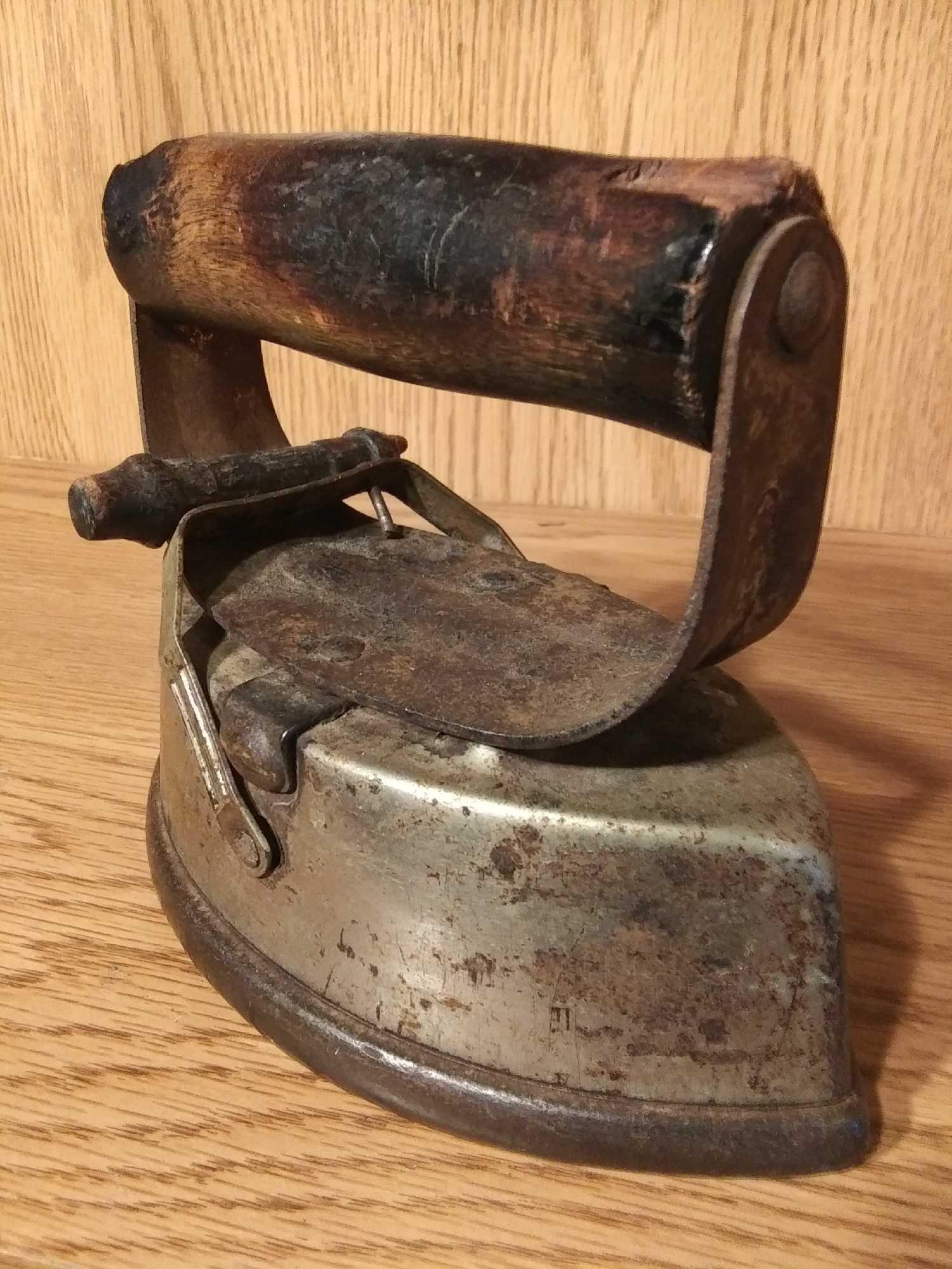 VERY OLD ASBESTOS LOCKING SAD IRON WITH WOODEN HANDLES